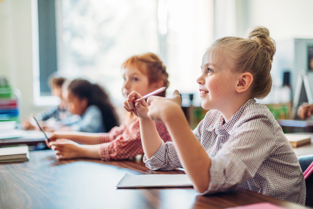 children sitting in a classroom