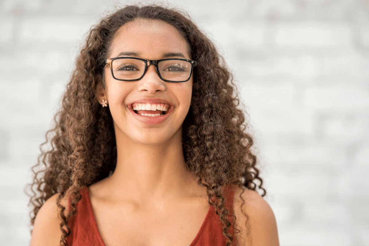 a teenage girl wearing glasses