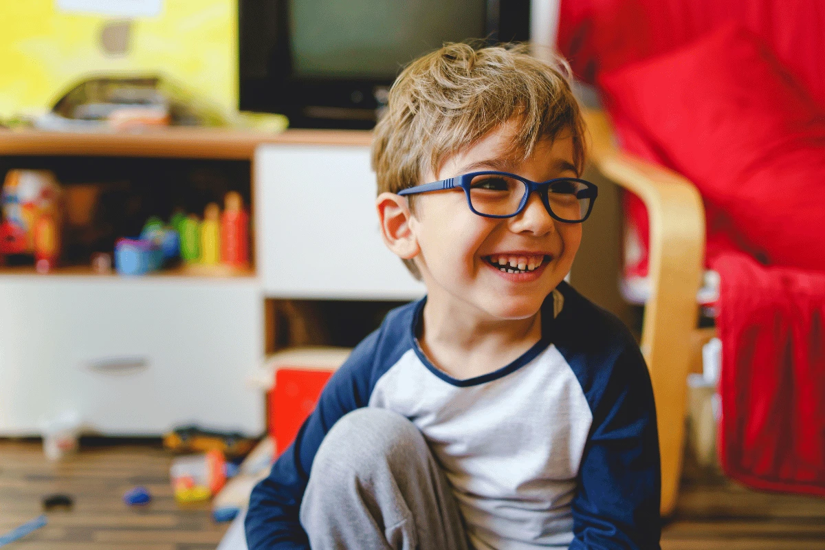 a young boy wearing glasses for nearsightedness